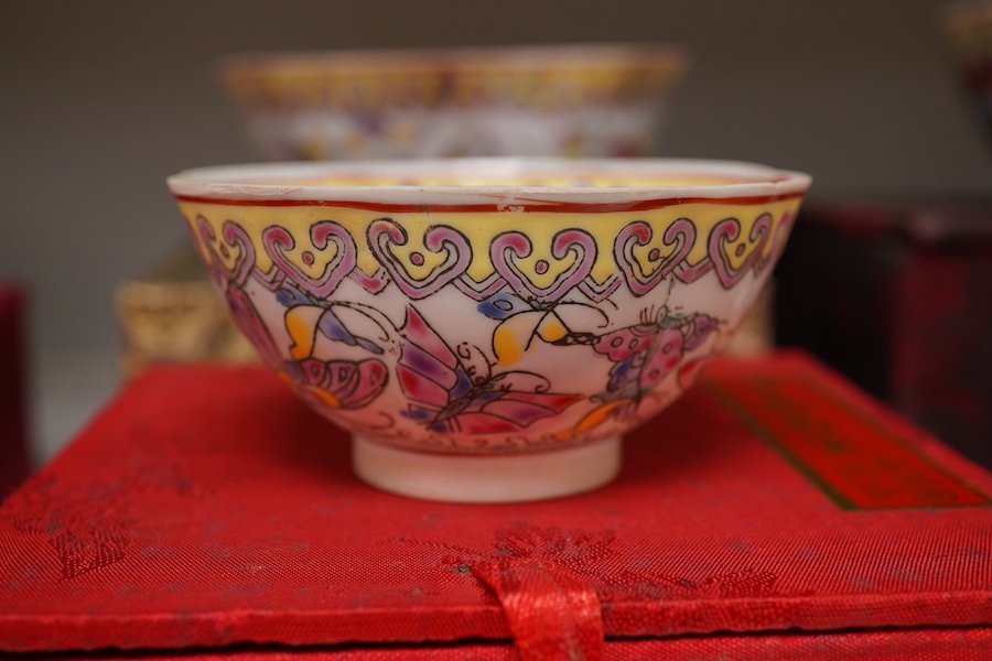 A collection of late 20th century Chinese boxed eggshell bowls, and four wood stands